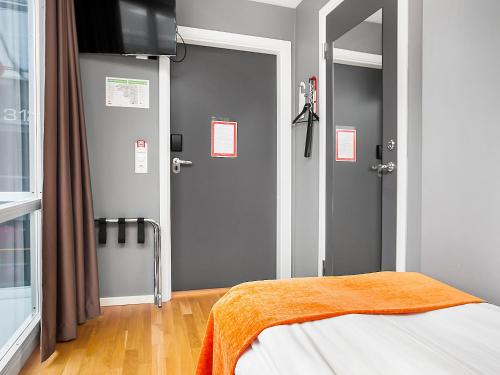 Aiden by Best Western Stockholm Kistaにあるベッド