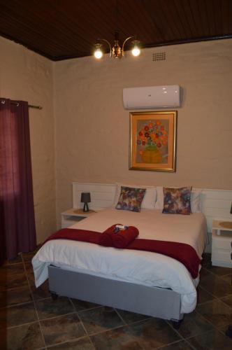 Ένα ή περισσότερα κρεβάτια σε δωμάτιο στο Esmarline Lodge
