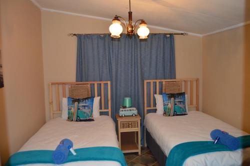 Ένα ή περισσότερα κρεβάτια σε δωμάτιο στο Esmarline Lodge