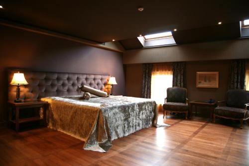 Ένα ή περισσότερα κρεβάτια σε δωμάτιο στο Ventura Boutique Hotel