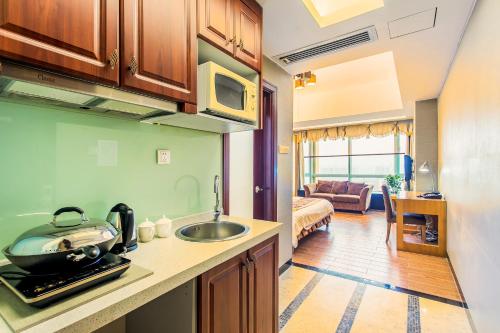 Kjøkken eller kjøkkenkrok på Grand Continental Apartment