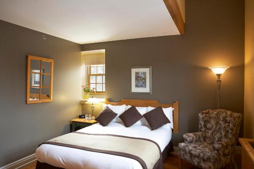 Кровать или кровати в номере Moulin Wakefield Mill Hotel & Spa