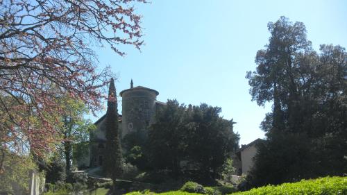 an old house with a chimney on top of it at Camping Daino in Pietramurata