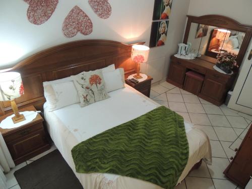 Ένα ή περισσότερα κρεβάτια σε δωμάτιο στο Rita's Guesthouse CC