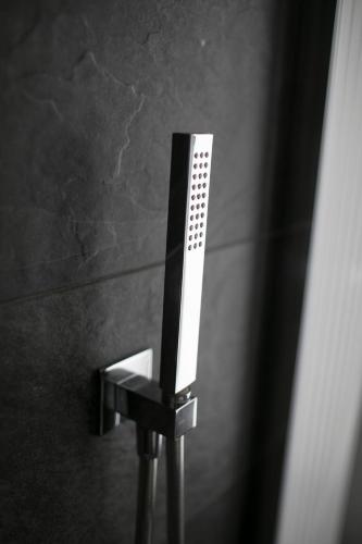 a mirror on a pole in a bathroom at Country House Villa Barbero in Mango