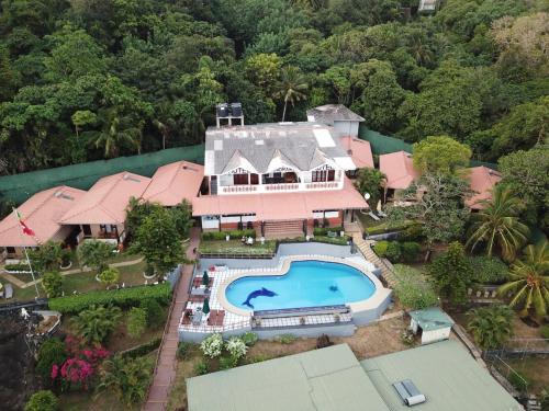 an aerial view of a house with a swimming pool at Hotel Panorama in Unawatuna