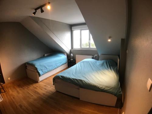 Tempat tidur dalam kamar di Sunset Dieppe