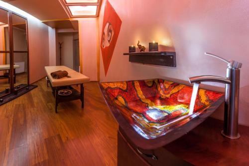 a room with a bed in the corner of a room at Galaxy Hotel in Kraków
