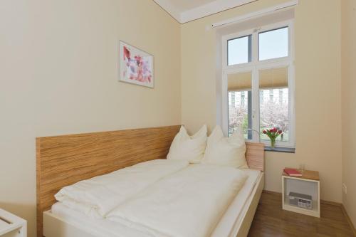 Llit o llits en una habitació de City Park Boardinghouse - #25-30 - Freundliche Apartments, wahlweise mit Frühstück, im Zentrum