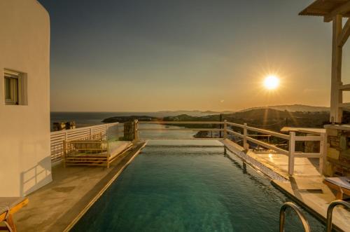 a swimming pool with a view of the ocean at Eden View Suites & Villas in Paradise Beach