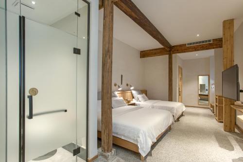 Hongcun old street Country Houseにあるベッド