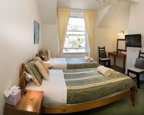 Somerset House B&B tesisinde bir odada yatak veya yataklar