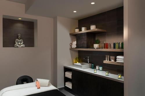 Ein Bett oder Betten in einem Zimmer der Unterkunft Best Western Plus La Demeure