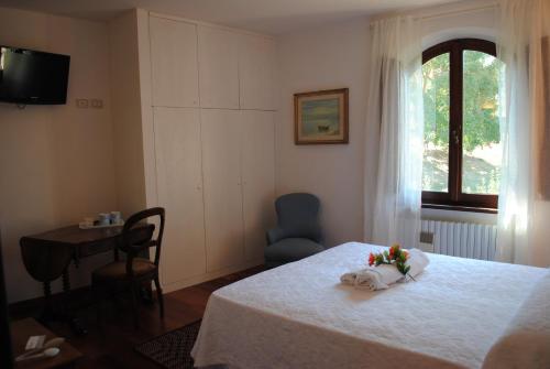 Ένα ή περισσότερα κρεβάτια σε δωμάτιο στο La Casa dei Vezzi