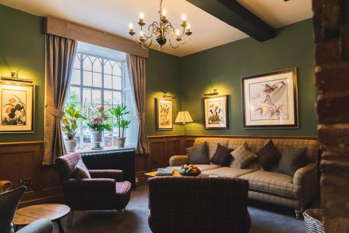 a living room with a couch and a table at Arrow Mill- Brunning and Price in Alcester