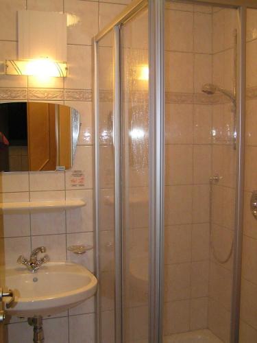 a bathroom with a shower and a sink at Haus Fallesin in Sankt Anton am Arlberg