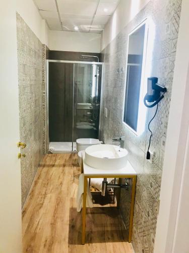 a bathroom with a sink and a shower at Palazzo Otello 1847 Wellness & Spa in Vicenza