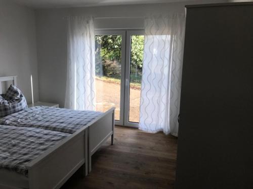Ένα ή περισσότερα κρεβάτια σε δωμάτιο στο Ferienhaus Stricker