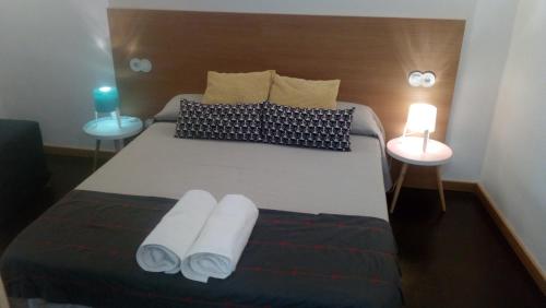 Katil atau katil-katil dalam bilik di Apartamentos 14DeSande