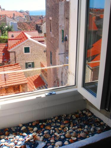 a window with a view of a city at Split Inn Apartments in Split