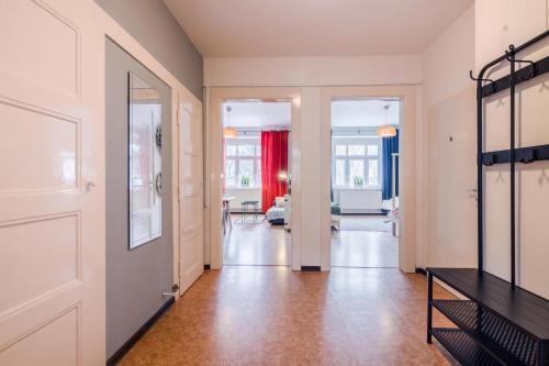 a hallway with a door leading to a living room at APT with sunny garden Prague by Michal&Friends in Prague