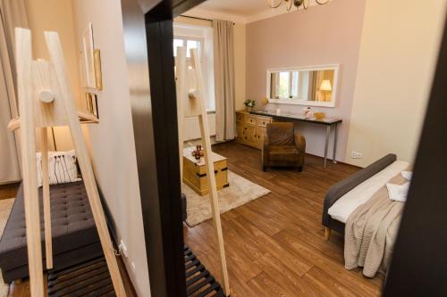 a bedroom with a bed and a desk in a room at APT with sunny garden Prague by Michal&Friends in Prague