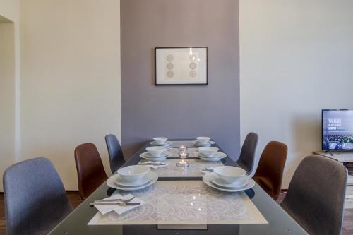 a dining room with a table and chairs at APT with sunny garden Prague by Michal&Friends in Prague