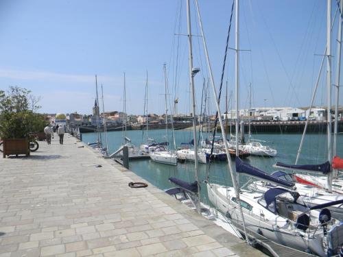 a group of boats docked at a marina at Hôtel SABLES D'O et son restaurant LE 16 BIS in Les Sables-dʼOlonne