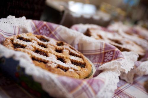 a group of pastries in a basket on a table at Sant'Andrea Agriturismo con cantina Martignago Vignaioli Asolo Prosecco Docg Wines in Maser
