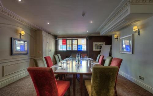 a conference room with a long table and chairs at Dog & Partridge by Chef & Brewer Collection in Tutbury