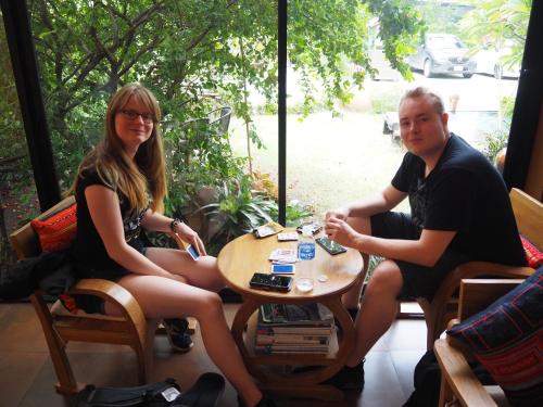 a man and a woman sitting at a table at The Choice Hotel - Adults Only in Bangkok