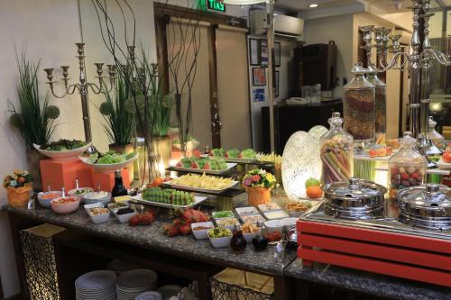 a buffet with many different food items on a table at The Malayan Plaza Hotel in Manila