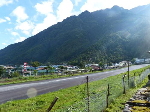 a view of a road with a mountain in the background at Lukla Airport Resort Lukla in Lukla