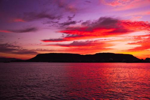 a sunset over a large body of water at WeBase TAKAMATSU in Takamatsu