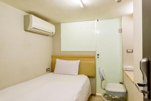 Postel nebo postele na pokoji v ubytování Shihlin Metro Home