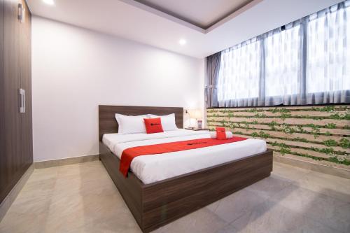 Tempat tidur dalam kamar di AHA Residence Dien Bien Phu near Hang Xanh Binh Thanh