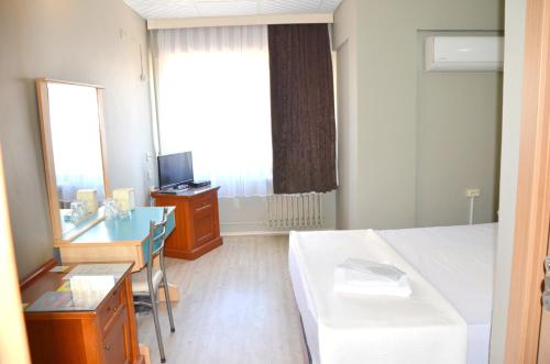 Ένα ή περισσότερα κρεβάτια σε δωμάτιο στο Elite Hotel City Center Saray Bed and Breakfast