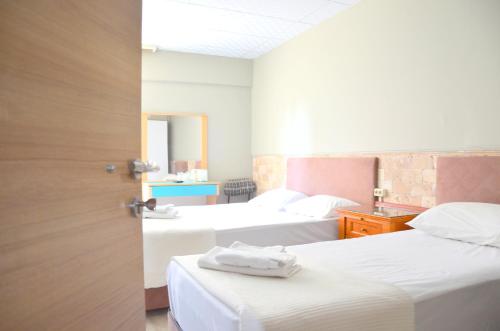Ένα ή περισσότερα κρεβάτια σε δωμάτιο στο Elite Hotel City Center Saray Bed and Breakfast