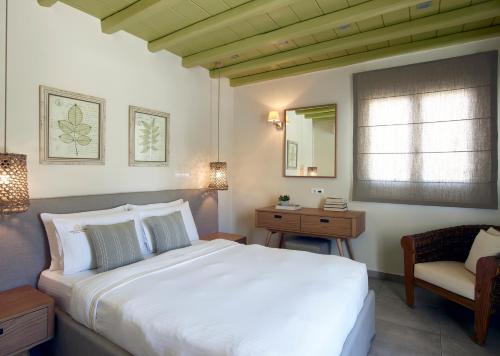 A bed or beds in a room at Vencia Boutique Hotel