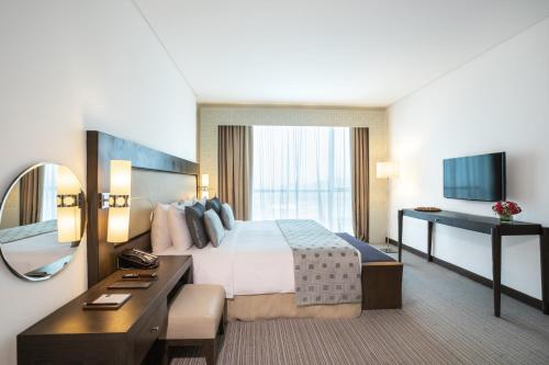 Ένα ή περισσότερα κρεβάτια σε δωμάτιο στο Royal M Hotel Fujairah by Gewan