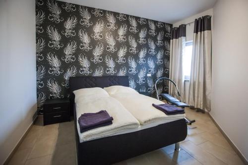 Postel nebo postele na pokoji v ubytování MOTEL Schlegel