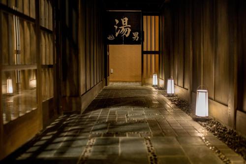 an empty hallway with lights in a building at Roygent Parks Hanoi in Hanoi
