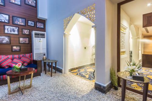a living room with a couch and two tables at Al Muhaidb Takhasosi Value in Riyadh
