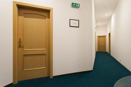 a corridor of an office with a door at Penzion U Vlka in České Budějovice
