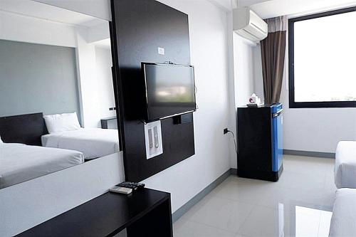 Katil atau katil-katil dalam bilik di Izen Budget Hotel & Residence