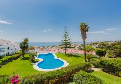 an aerial view of a swimming pool in a park at Apartamentos Torrenueva Park in La Cala de Mijas