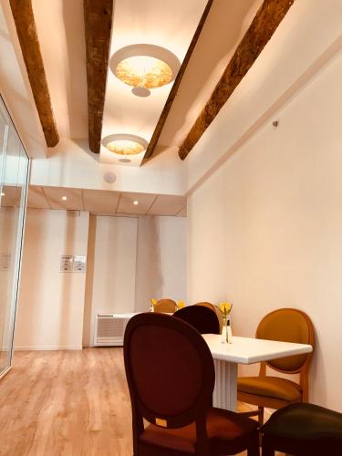 a dining room with a table and chairs at Palazzo Otello 1847 Wellness & Spa in Vicenza