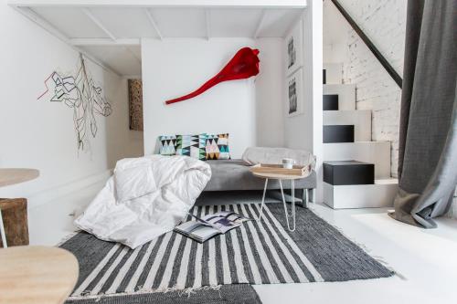 A bed or beds in a room at Almudena Modern & luxury space near Plaza Mayor