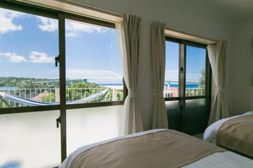 Postel nebo postele na pokoji v ubytování Sea Sunset Villa
