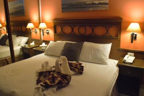 Postel nebo postele na pokoji v ubytování Capri Hotel Suites